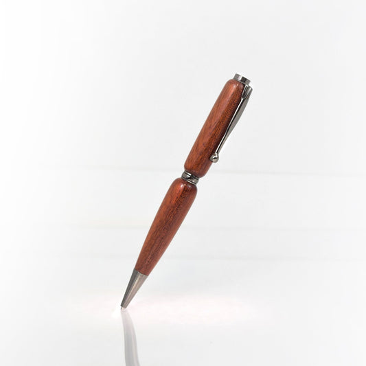 Handcrafted Bloodwood pen with high-gloss finish and refillable black ink insert