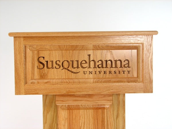 Counselor Swivel™ Podium with 45-degree swivel mechanism, adjustable work surface, and engraved top.