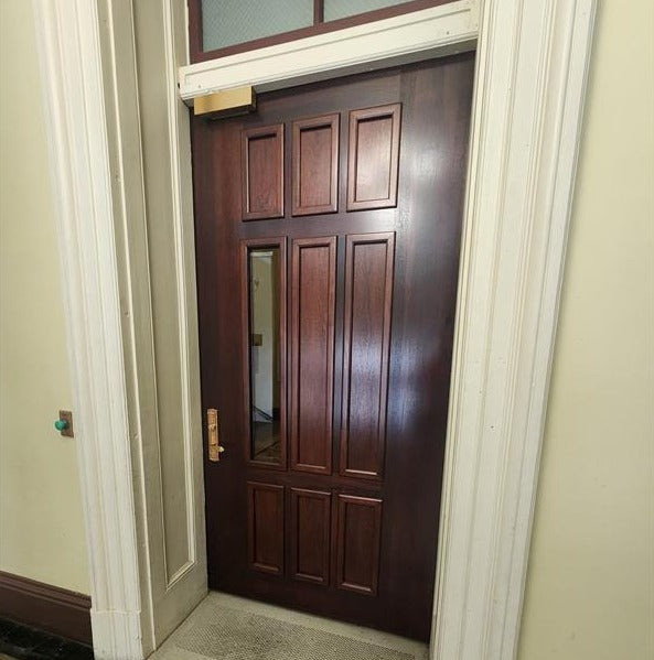Commercial Style Door – Security door with a narrow 6-inch ballistic window, ideal for schools, offices, and commercial spaces.