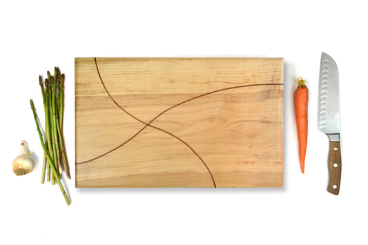 Handmade maple cutting board with walnut inlay, food-safe and artisan-crafted in Missouri