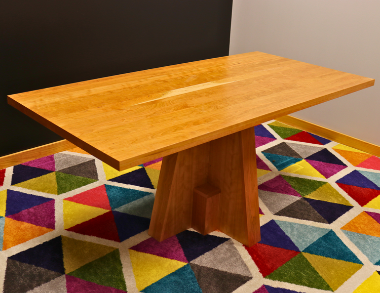 Handcrafted executive office table featuring a luxurious solid cherry wood top. The table showcases a smooth, rich cherry finish with intricate wood grain details, perfect for adding a timeless and professional touch to any office space. american made durable steady