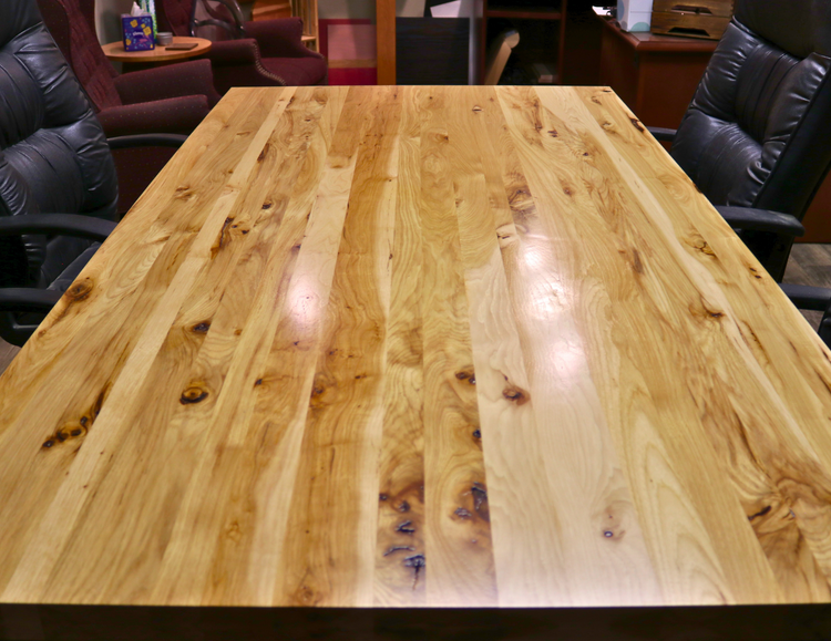 Handcrafted executive office table with a luxurious solid rustic hickory wood top. The table features a rich, natural finish with unique wood grain patterns, adding a touch of sophistication and durability to any office space. American made durable