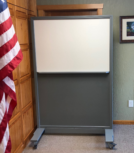 Portable NIJ Level III ballistic panel with a whiteboard, tackable surface, and locking casters for school safety and security.
