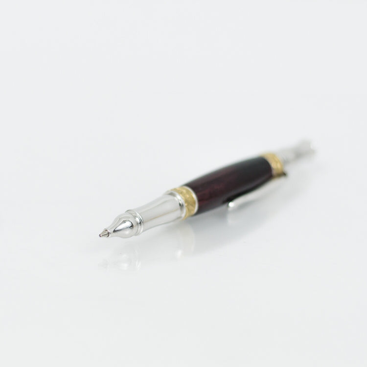 Handcrafted African Blackwood rollerball pen with 24K gold accents