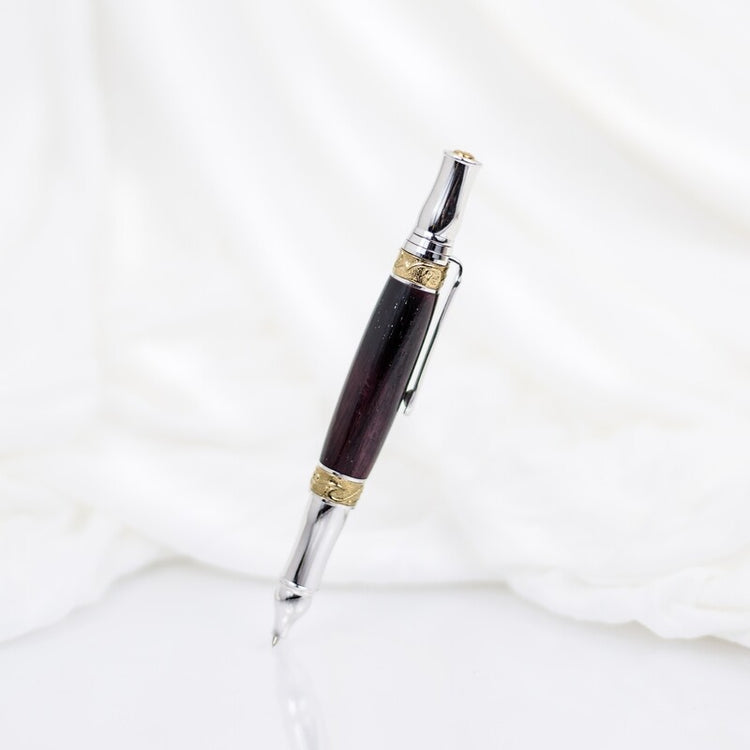 Handcrafted African Blackwood rollerball pen with 24K gold accents