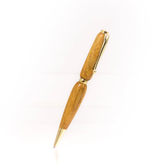 Handcrafted Canarywood pen with yellow and red streaked grain, glossy finish, and refillable black ballpoint ink insert, made in Missouri