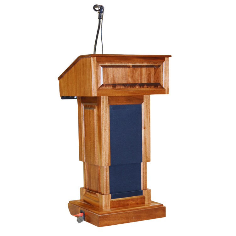 The Counselor Evolution Lift™ podium, handcrafted from premium wood, features power adjustable height, built-in sound system, and casters.