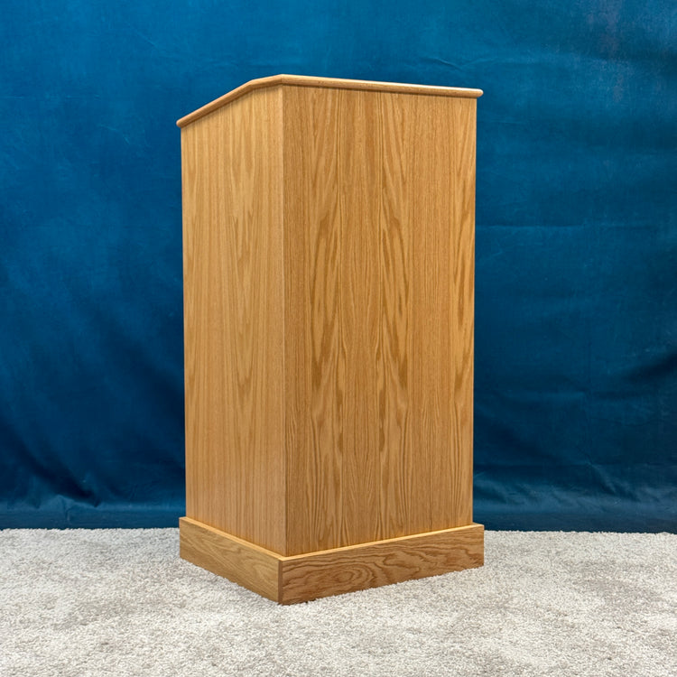 Wooden podium against a blue background