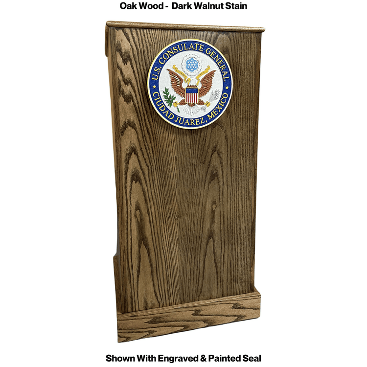 Graduate™ Podium (GRAD411) with angled work surface, flat reveal for tech, solid oak construction, storage shelves, and casters.