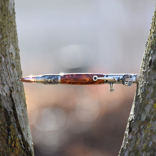 Handcrafted Thuya Burl bolt action pen with bullet tip, deer clip, glossy finish, and refillable black ballpoint ink insert