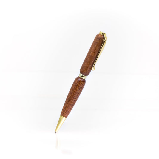 Handcrafted Lacewood pen with light reddish-brown grain, glossy finish, and refillable black ballpoint ink insert, made in Missouri