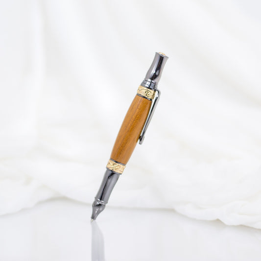 Handcrafted Osage Orange rollerball pen with 24K gold accents and metal body
