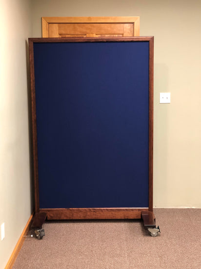 Portable NIJ Level III ballistic panel with a whiteboard, tackable surface, and locking casters for school safety and security.