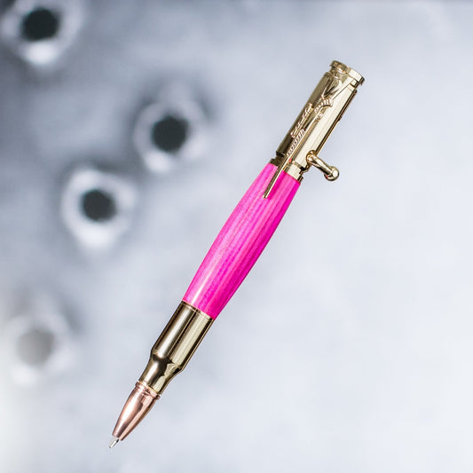 Pink bolt action rifle clip pen made from laminated wood with bullet tip and glossy finish, handcrafted in Missouri