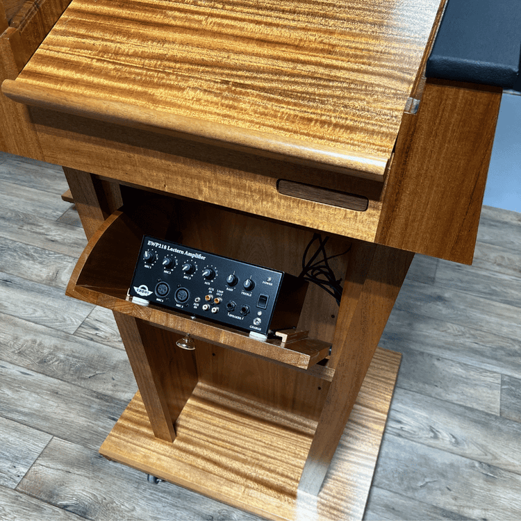 Premium solid wood sound podium with built-in speakers, gooseneck microphone, LED light, magnetic logo system, and pop-out beverage holder.