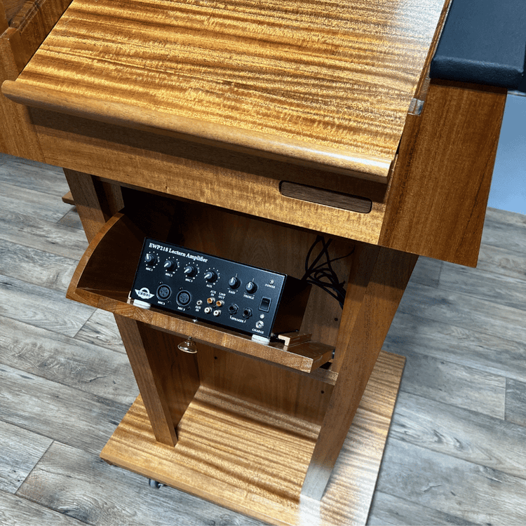 Premium solid wood sound podium with built-in speakers, gooseneck microphone, LED light, magnetic logo system, and pop-out beverage holder.