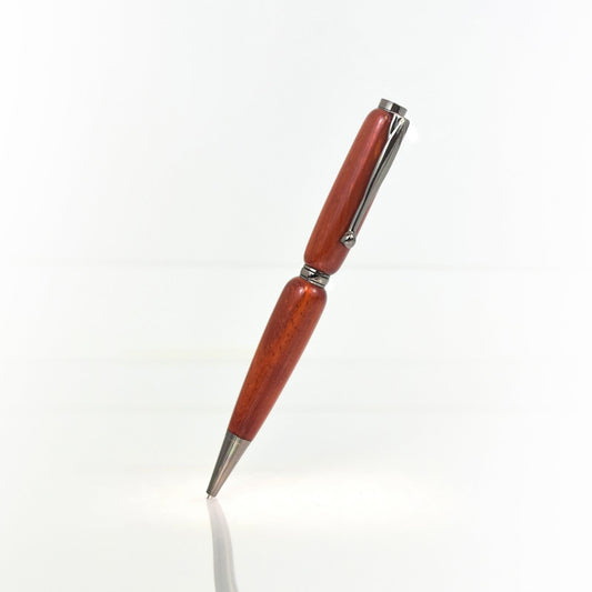 Handcrafted Redheart wood pen with glossy finish and refillable black ballpoint ink insert