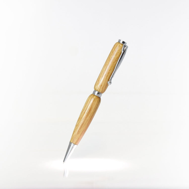 Handcrafted Red Oak wood pen with glossy finish and refillable black ballpoint ink insert