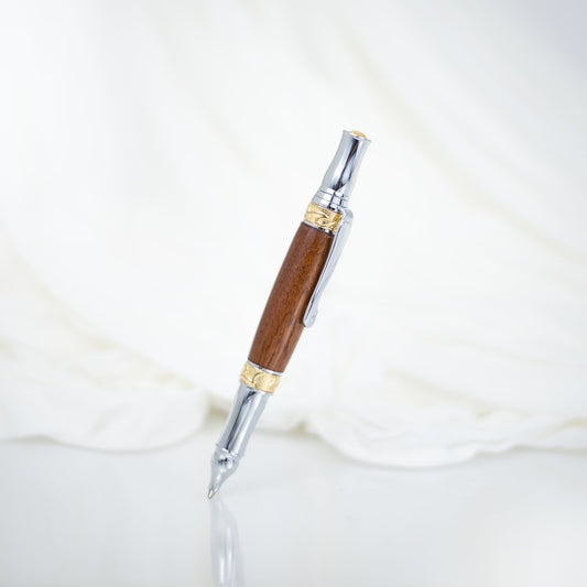 Handcrafted walnut rollerball pen with 24K gold accents and metal body