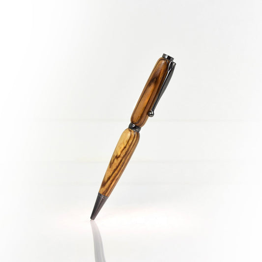 Handcrafted Zebrawood pen with striped grain, glossy finish, and refillable black ballpoint ink insert