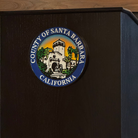 carved and painted seal on a podium