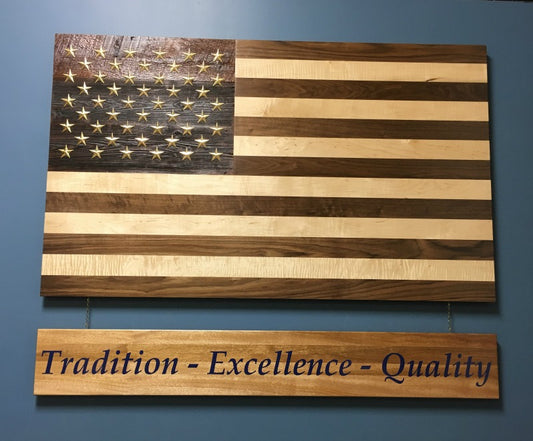 Handcrafted solid wood American flag with walnut and maple stripes, brass stars, and a reclaimed barn wood star background.