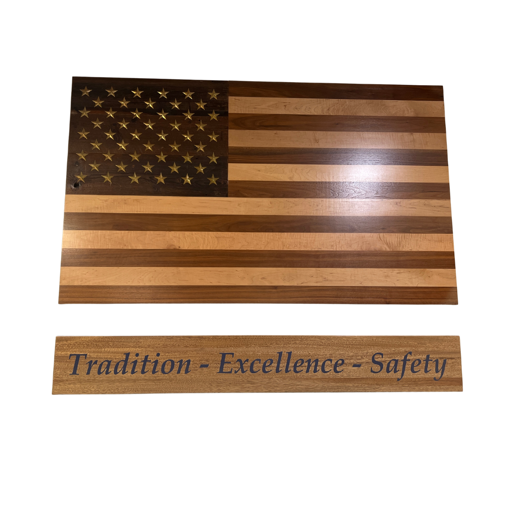 Handcrafted solid wood American flag with walnut and maple stripes, brass stars, and a reclaimed barn wood star background.