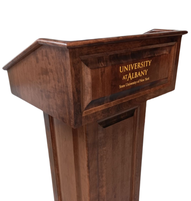Counselor Swivel™ Podium with 45-degree swivel mechanism, adjustable work surface, and engraved and painted top.
