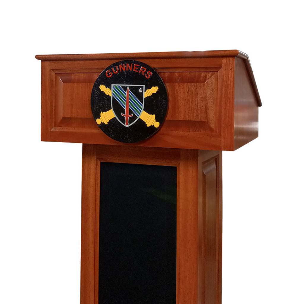The Counselor Evolution Lift™ lectern, handcrafted from mahogany wood, features adjustable height, built-in sound system, and mobility casters.