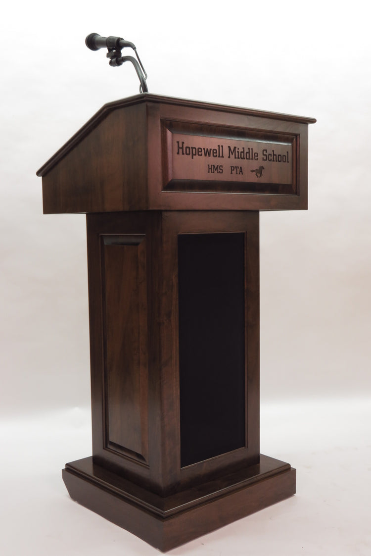 The Counselor Evolution™ all-in-one lectern, handcrafted in the USA, features adjustable work surface, built-in sound system, and portable design.