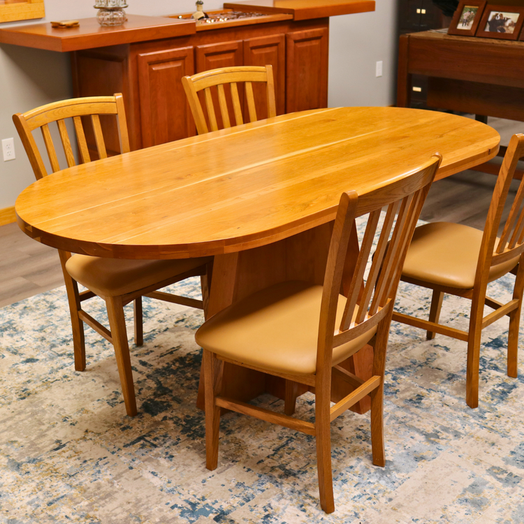 Solid top cherry oval conference table, 72” x 34.5”, handcrafted in the USA for executive offices, boardrooms, and professional spaces.