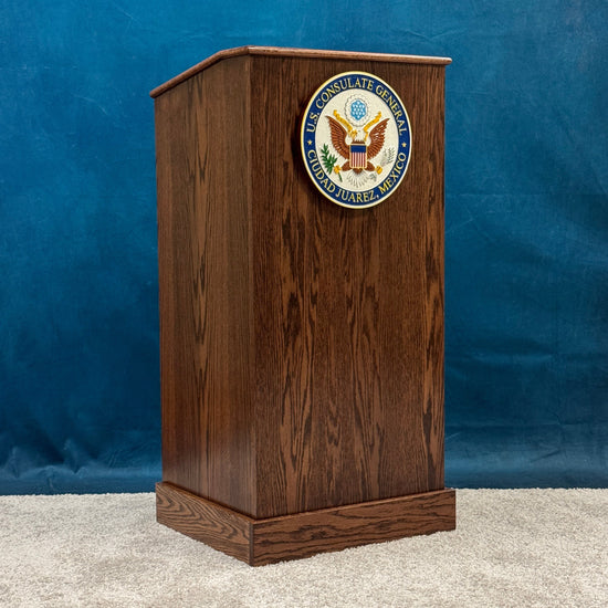 Wooden podium with a seal on a blue background