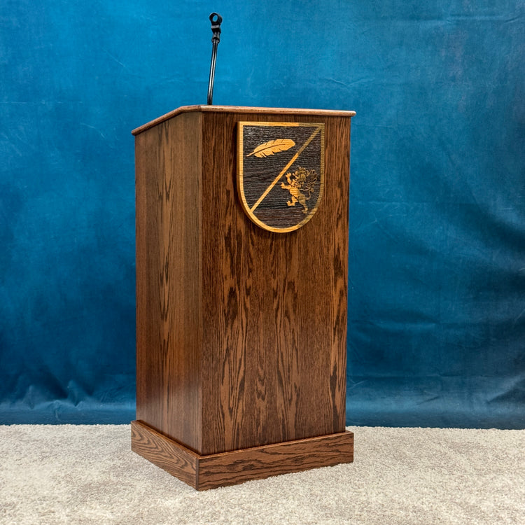 Wooden lectern with a decorative emblem on a blue background