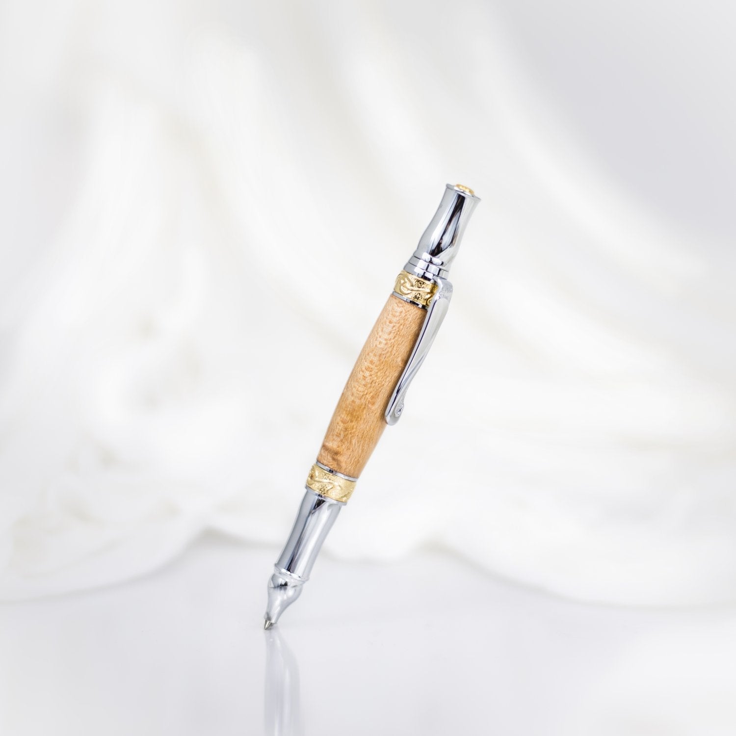 Handcrafted Sycamore wood rollerball pen with precious metal body