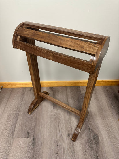 Solid wood saddle stand with a smooth finish, designed for stable and secure saddle storage. The stand features a sturdy base and simple, rustic design, perfect for any equestrian space. Handcrafted for durability and style. American made handcrafted