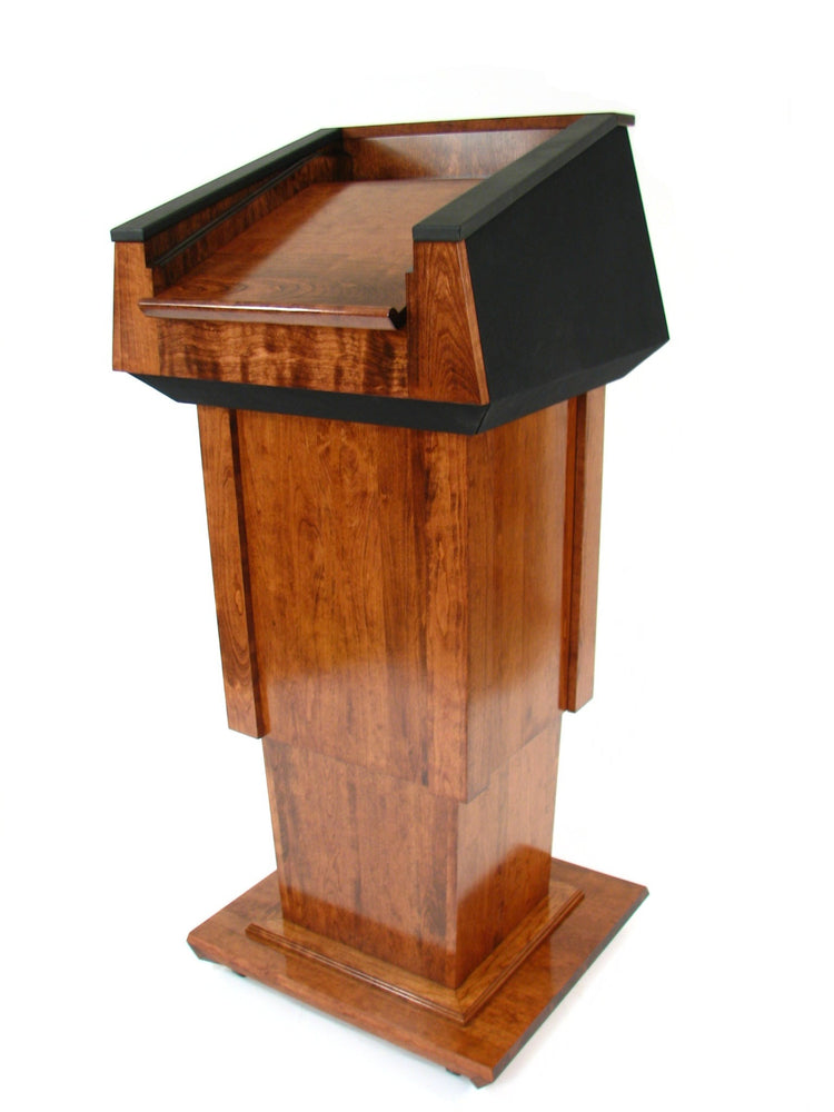 Height-adjustable wooden podium with magnetic front for logos, leather handrails, and a drop-down work surface for presentations.