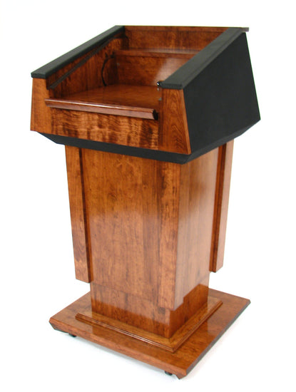 Height-adjustable wooden podium with magnetic front for logos, leather handrails, and a drop-down work surface for presentations.