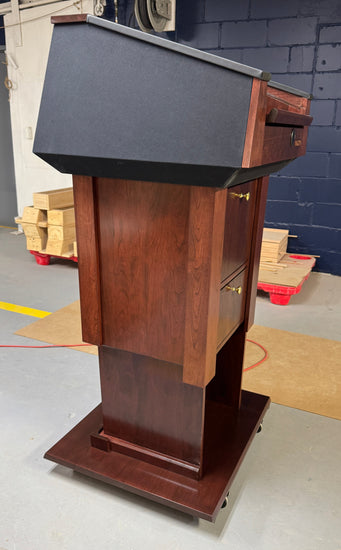 Wooden presidential podium with a black top
