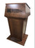 "Presidential™ Solid Hardwood Podium featuring a sleek, classic design with rich wood finish. The podium is crafted from solid hardwood, providing a sturdy and elegant stand for presentations, speeches, and lectures. Ideal for professional settings like conferences, universities, and executive meetings. TEXTILE FABRIC COVERING TOP SEAMLESS AMERICAN MADE HANDCRAFTED LECTERN MOBILE