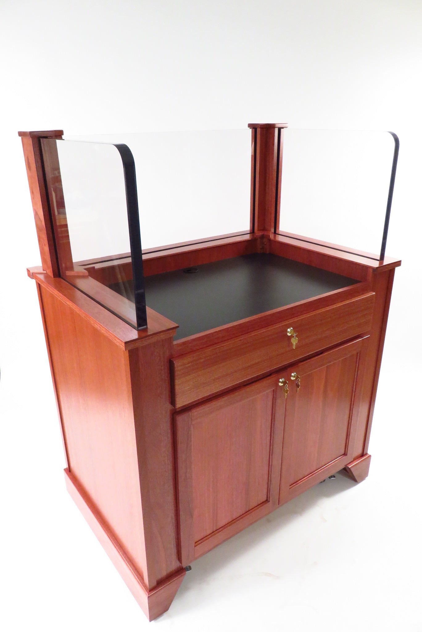 "Protector™ NIJ3 Bullet Resistant Mobile Workstation with a sturdy, sleek design. The workstation features a robust, armored body for enhanced security, mobility with hidden wheels, and ample workspace for efficient and safe operation in high-risk environments."