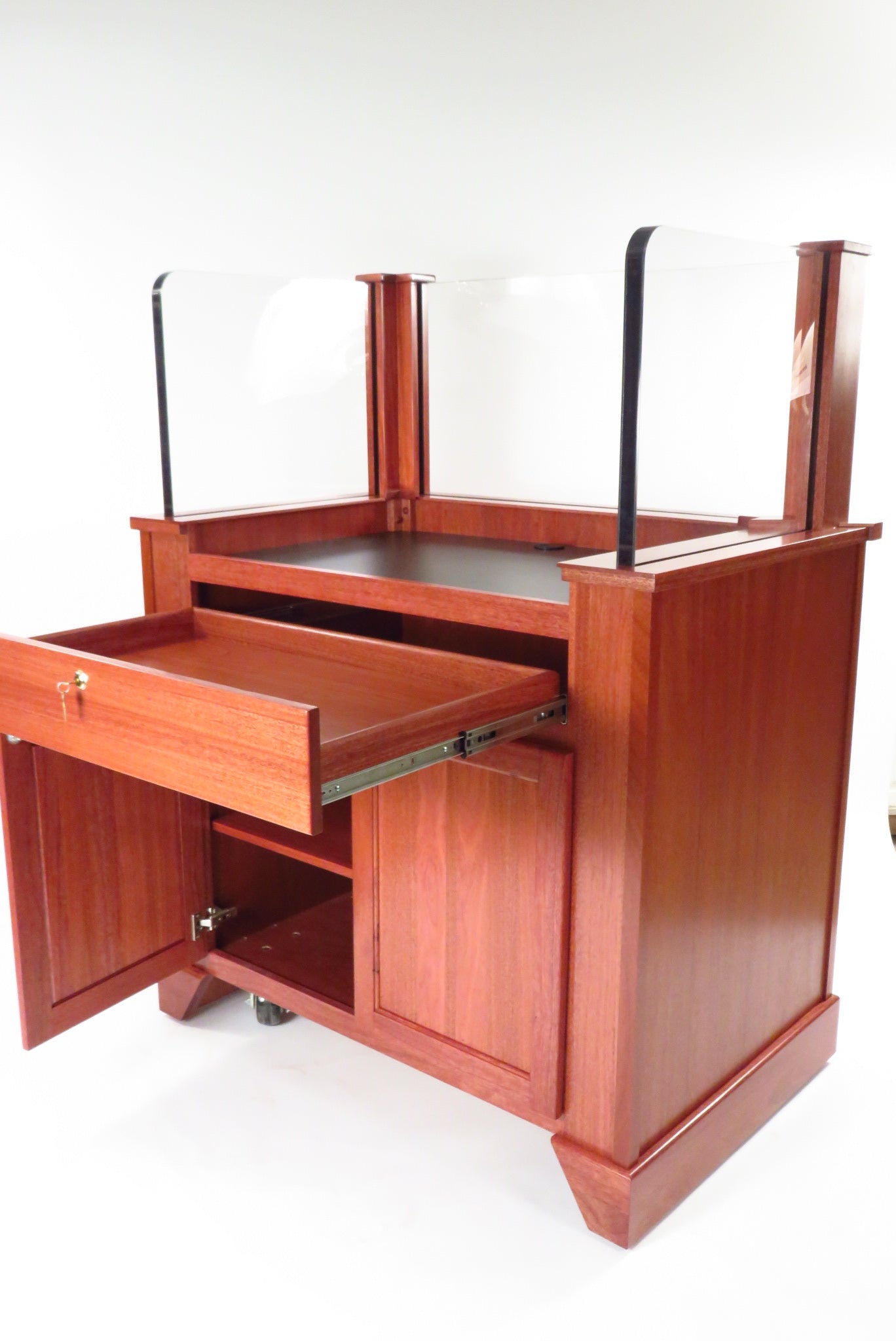 "Protector™ NIJ3 Bullet Resistant Mobile Workstation with a sturdy, sleek design. The workstation features a robust, armored body for enhanced security, mobility with hidden wheels, and ample workspace for efficient and safe operation in high-risk environments."