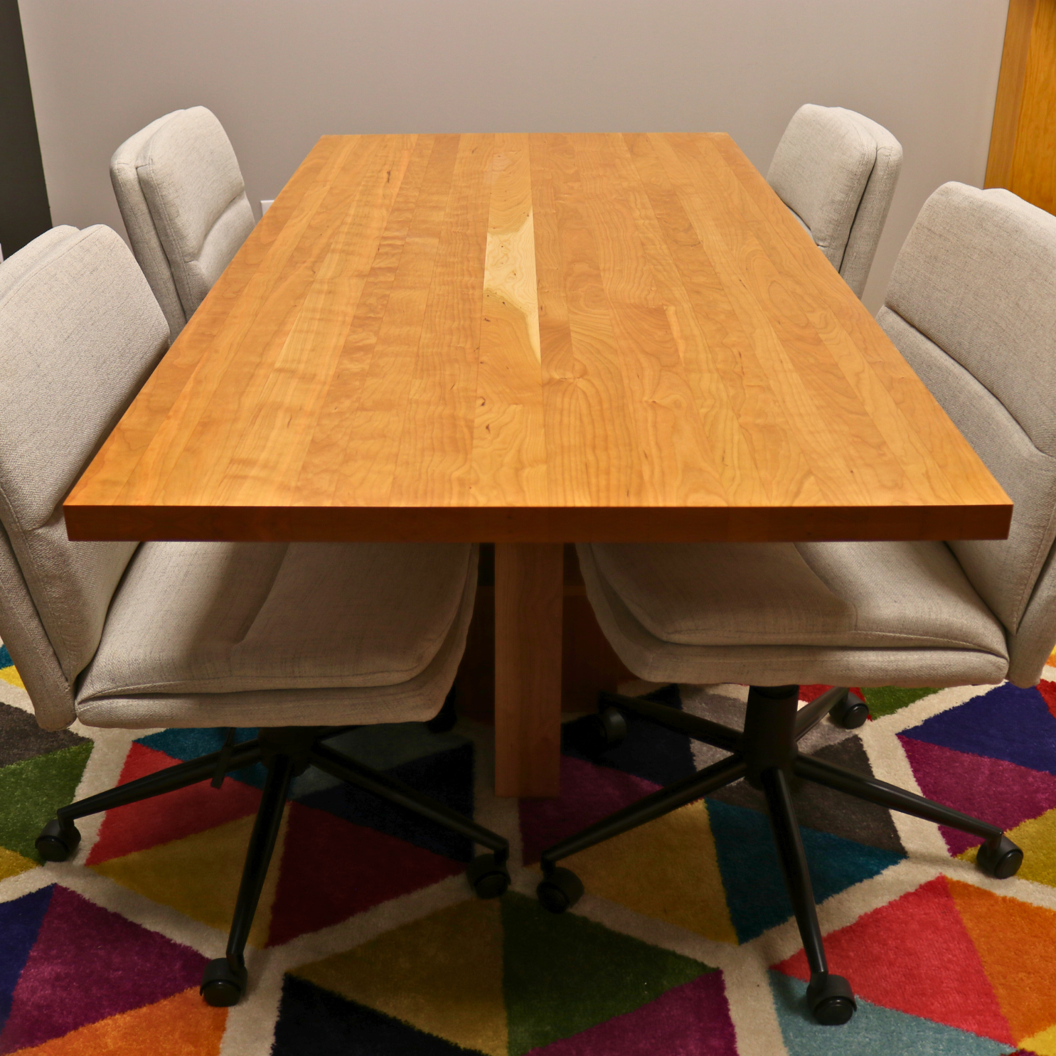 Handcrafted executive office table featuring a luxurious solid cherry wood top. The table showcases a smooth, rich cherry finish with intricate wood grain details, perfect for adding a timeless and professional touch to any office space. american made durable steady