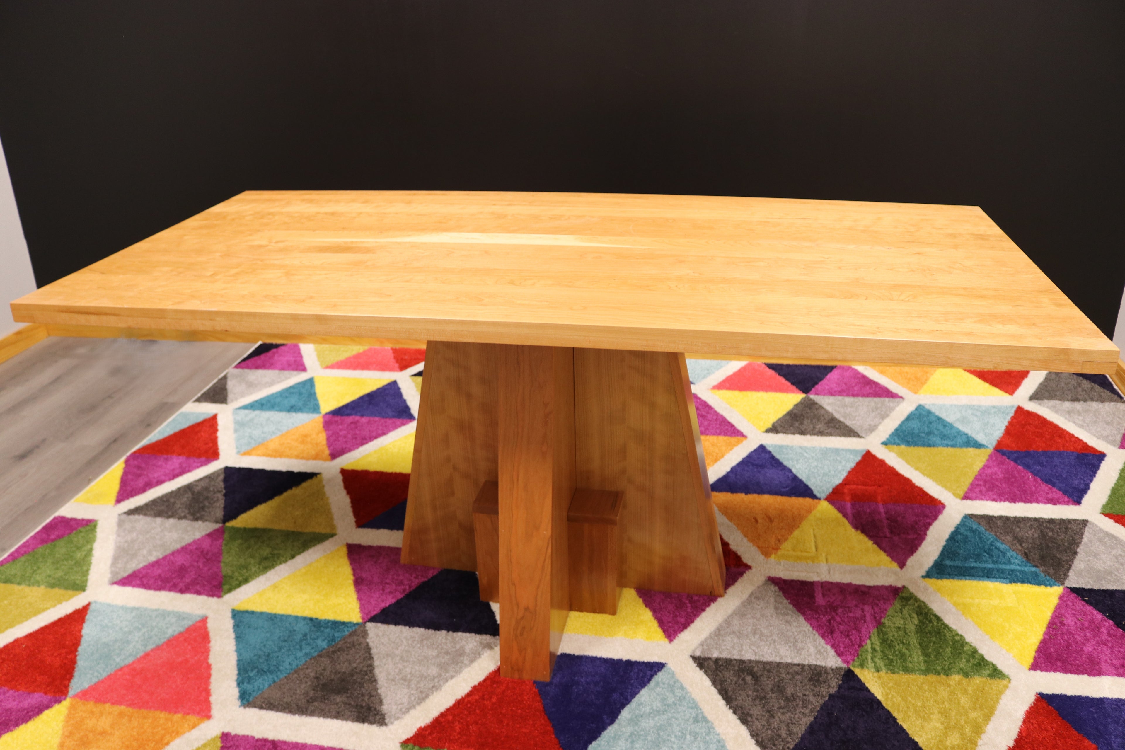 Handcrafted executive office table featuring a luxurious solid cherry wood top. The table showcases a smooth, rich cherry finish with intricate wood grain details, perfect for adding a timeless and professional touch to any office space. american made durable steady
