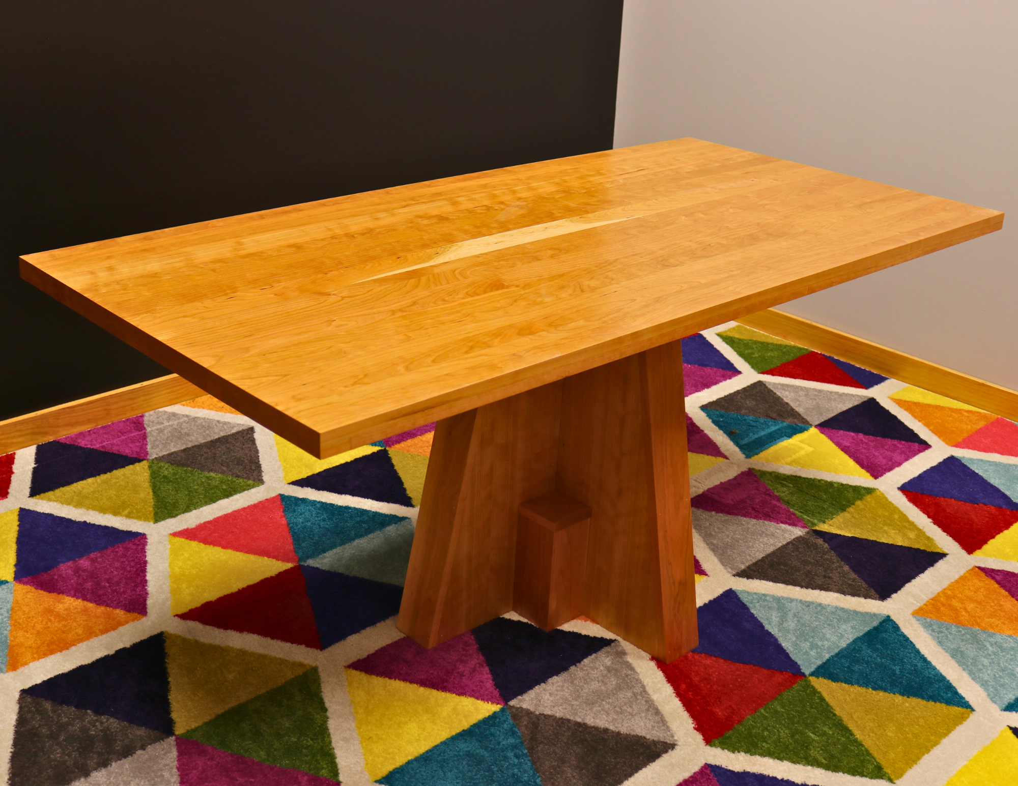 Handcrafted executive office table featuring a luxurious solid cherry wood top. The table showcases a smooth, rich cherry finish with intricate wood grain details, perfect for adding a timeless and professional touch to any office space. american made durable steady