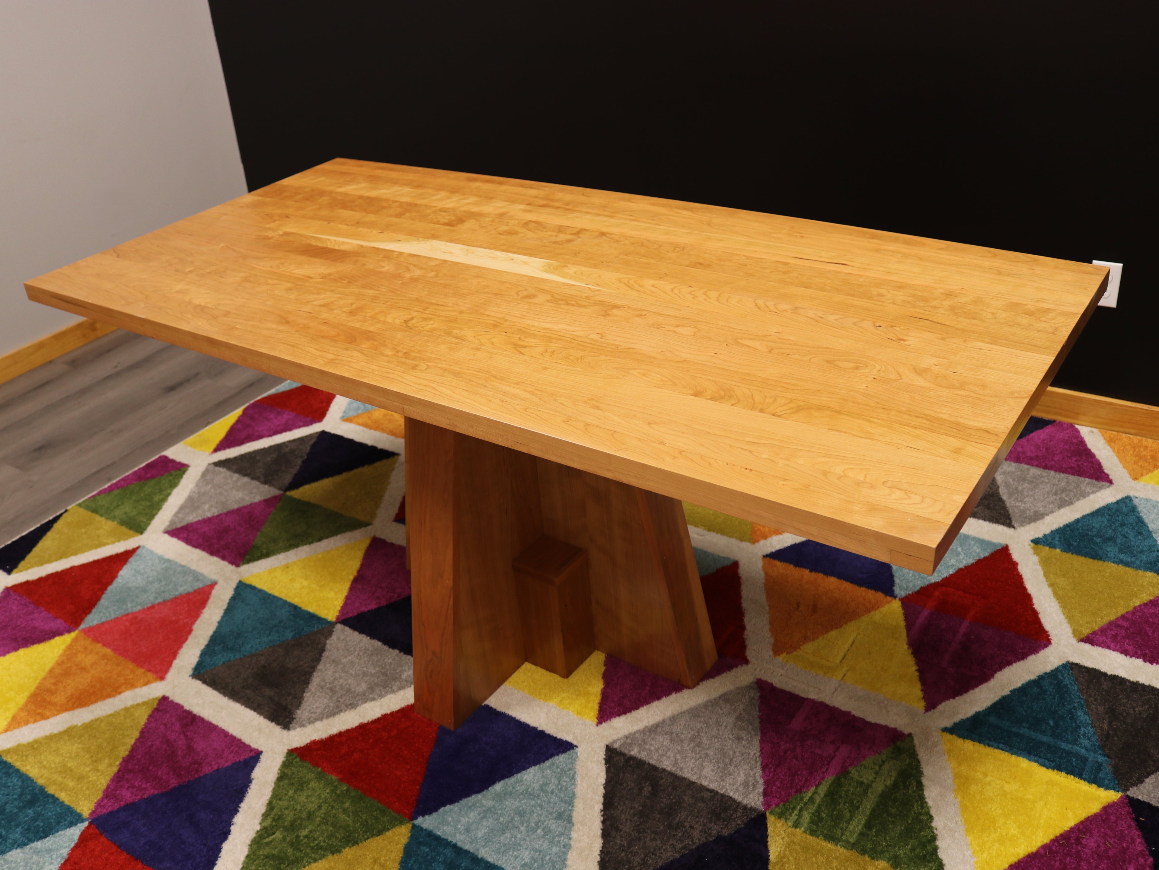 Handcrafted executive office table featuring a luxurious solid cherry wood top. The table showcases a smooth, rich cherry finish with intricate wood grain details, perfect for adding a timeless and professional touch to any office space. american made durable steady