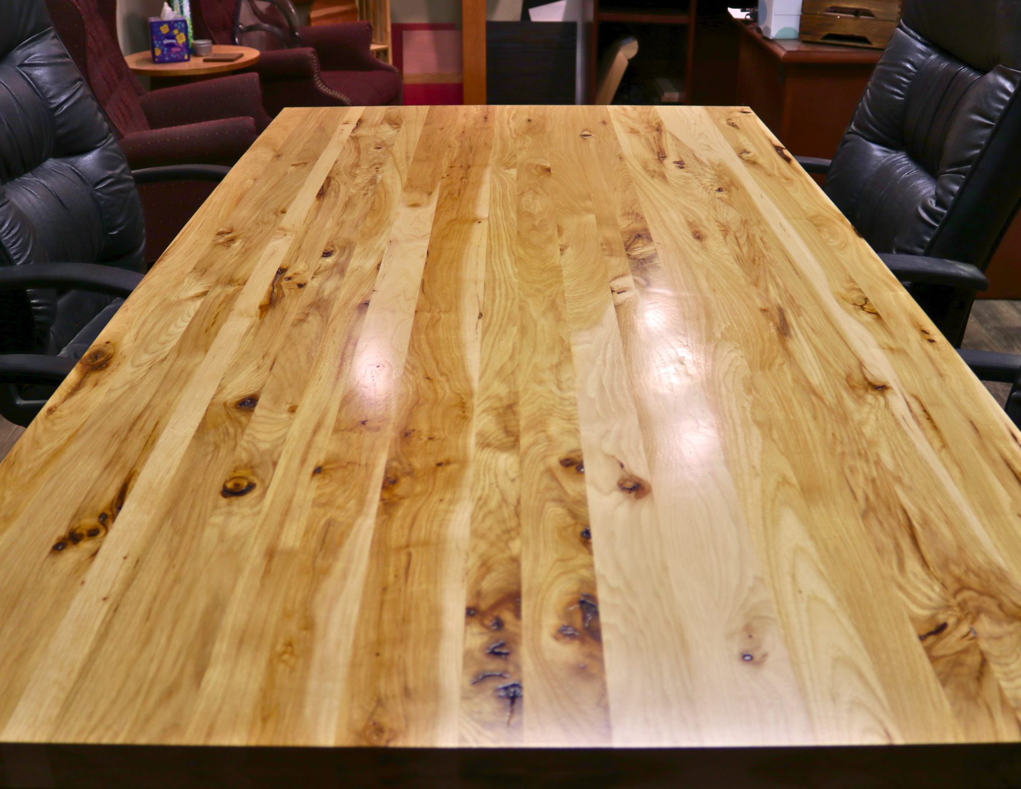 Handcrafted executive office table with a luxurious solid rustic hickory wood top. The table features a rich, natural finish with unique wood grain patterns, adding a touch of sophistication and durability to any office space. American made durable 