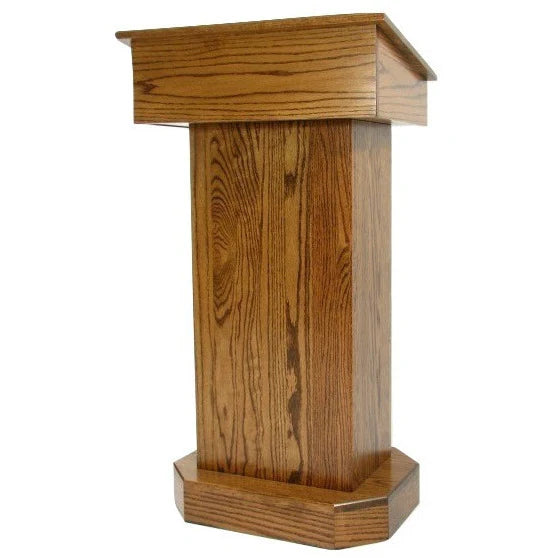  "Senator™ Solid Hardwood Podium, featuring a sleek design made from durable solid wood. It includes a spacious work surface, hidden rear casters for easy mobility, and ample storage space for supplies. Perfect for schools, churches, and event venues." American made craftsmanship Lectern