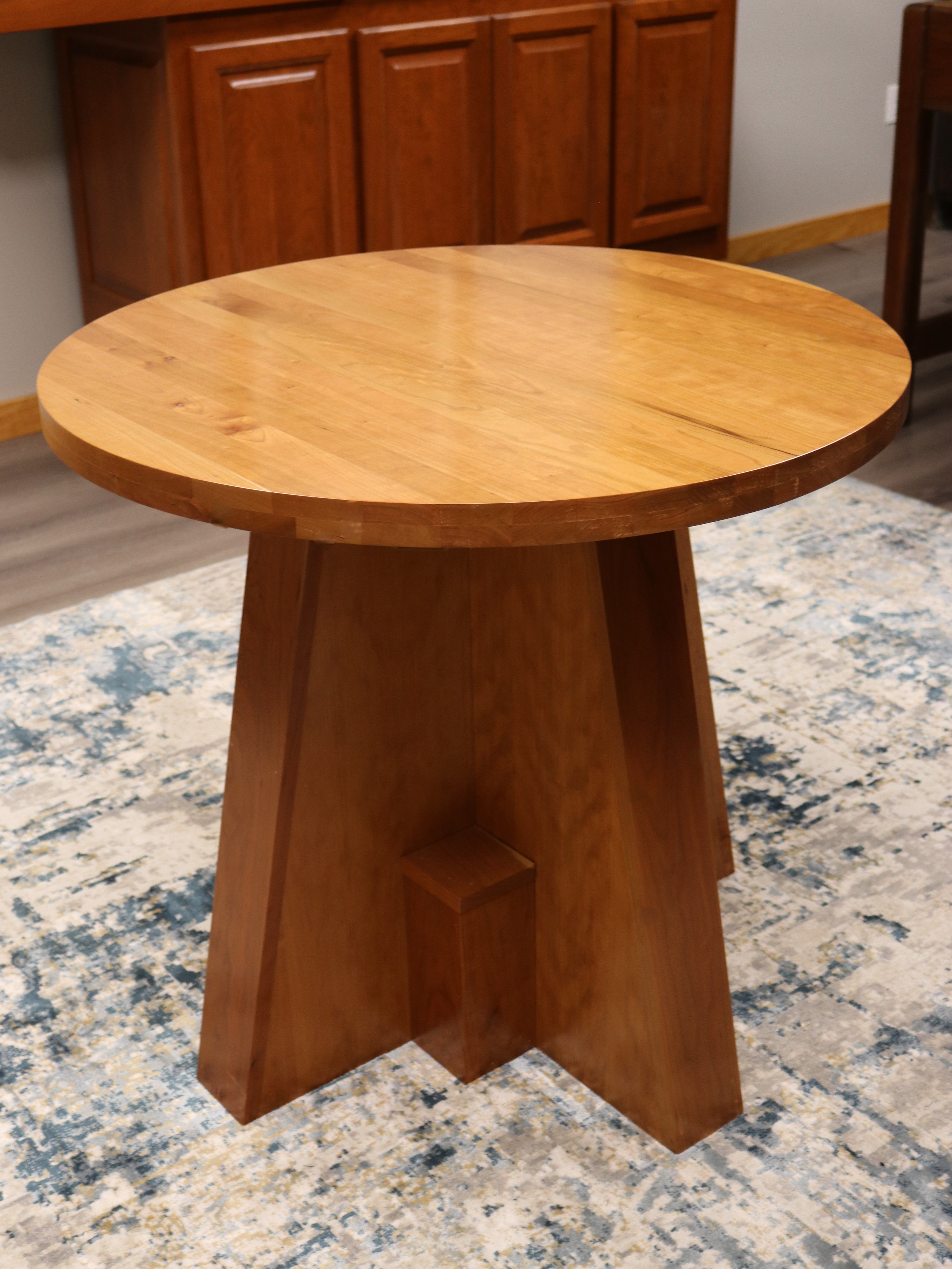 Handcrafted solid cherry wood round collaboration table, 34.5-inch diameter, perfect for executive offices, boardrooms, and upscale workspaces.