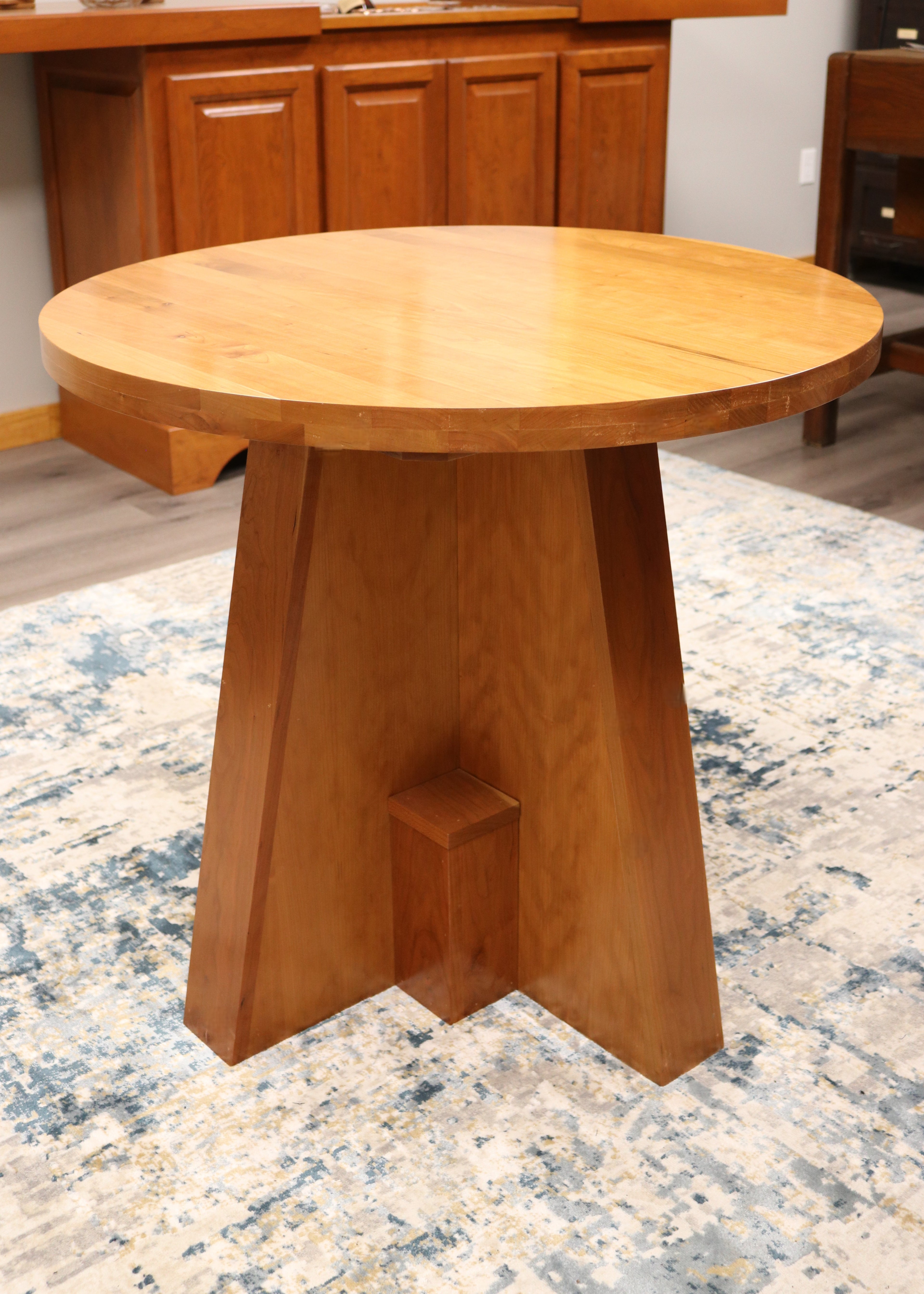 Handcrafted solid cherry wood round collaboration table, 34.5-inch diameter, perfect for executive offices, boardrooms, and upscale workspaces.