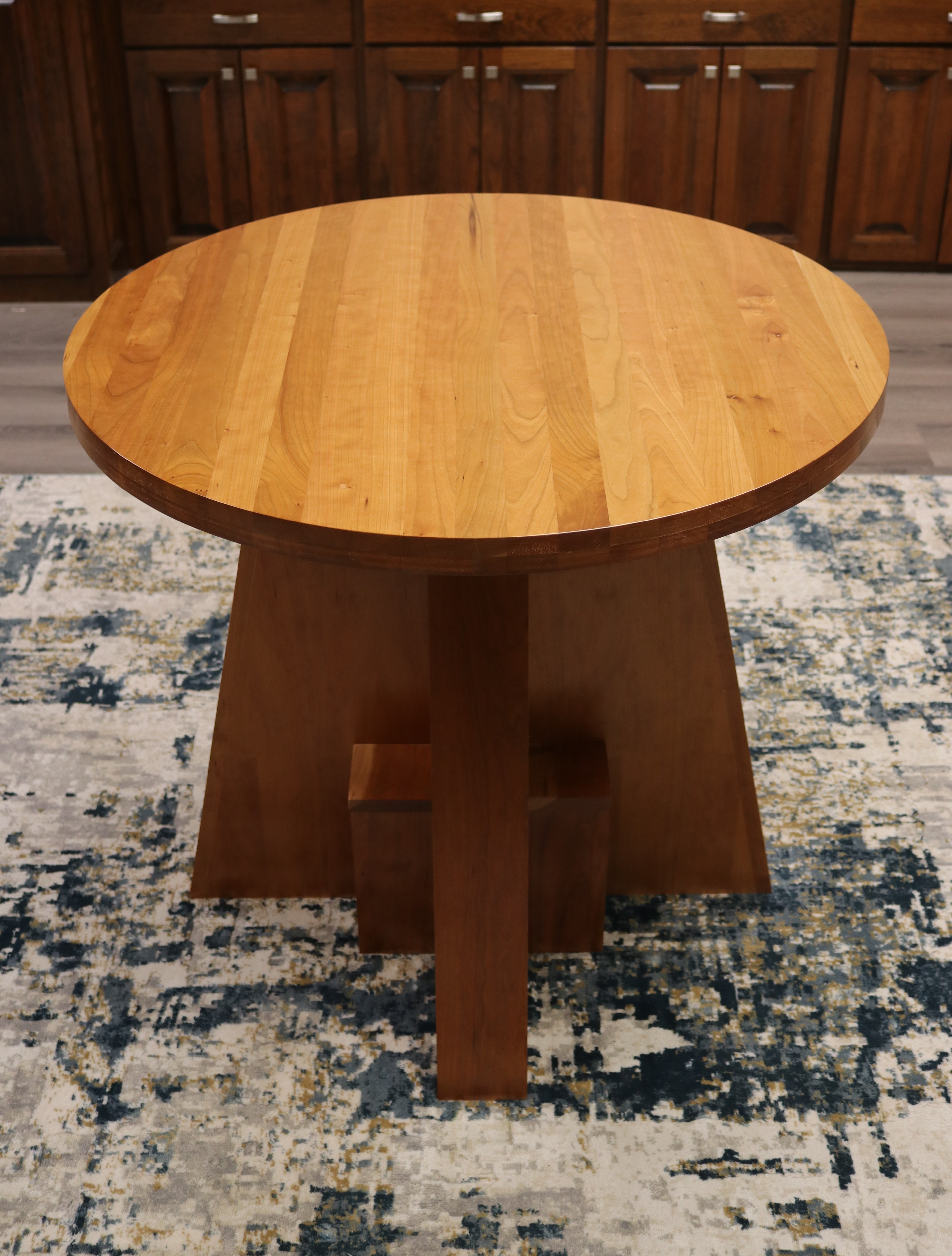 Handcrafted solid cherry wood round collaboration table, 34.5-inch diameter, perfect for executive offices, boardrooms, and upscale workspaces.